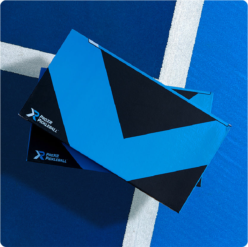 blue and black box with ProXR Pickleball branding on a blue court background